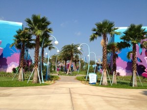 View of Disney's Art of Animation Resort after crossing Hourglass Lake bridge